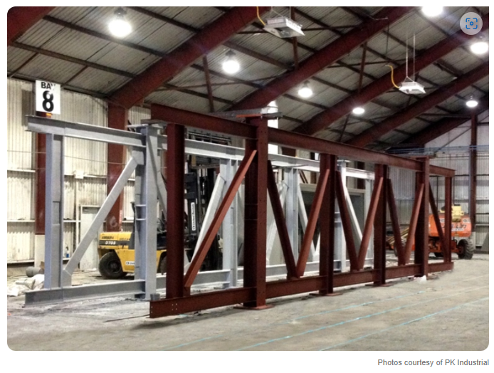 Structural steel at a petrochemical facility receiving protective coatings and fireproofing