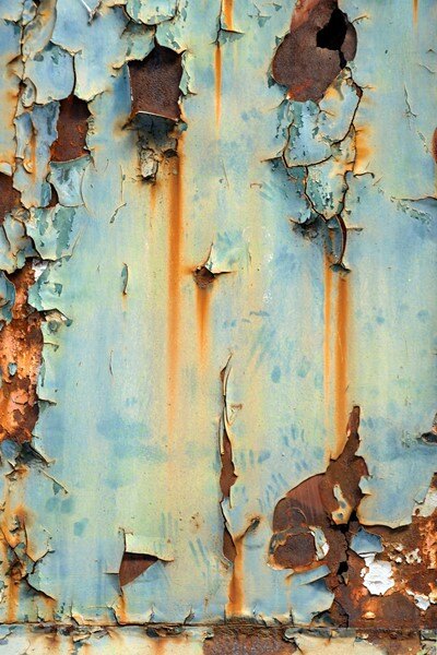 Localized surface deterioration and coating delamination on a metal substrate