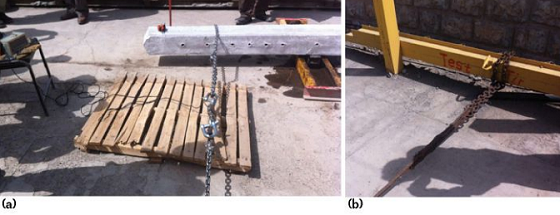Concrete pole bending test equipment showing a dynamometer and anchored pulling chain